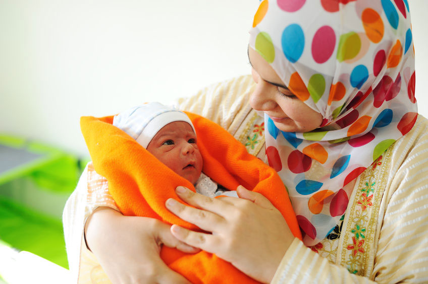 Mother Breast Feeding a Cute Baby. Newborn Girl. Stock Image