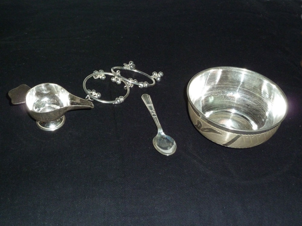 silver plated paled as part of a baby gift set