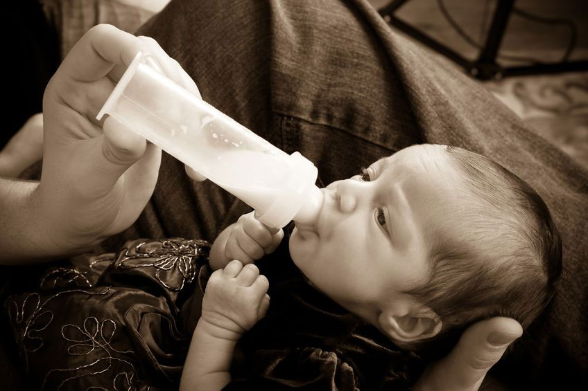 bottle feeding an underweight baby