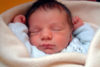Newborn asleep on http://breastfeeding.support
