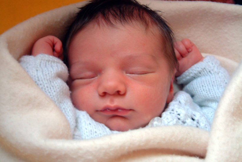 Newborn asleep on http://breastfeeding.support