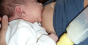 baby breastfeeding with a medela supplemental nursing system