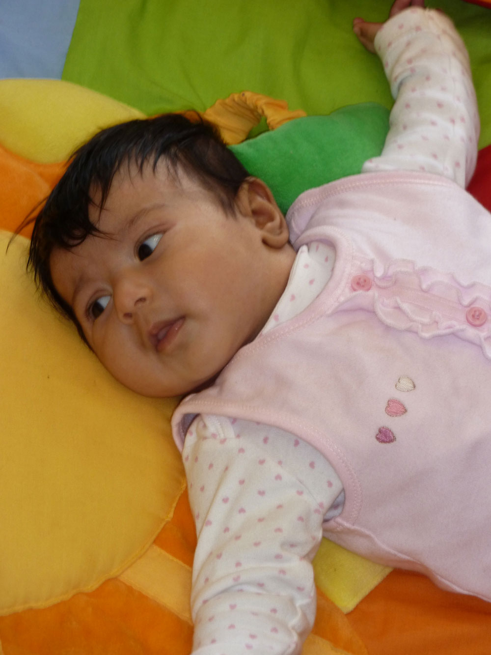 baby on a colourful mat