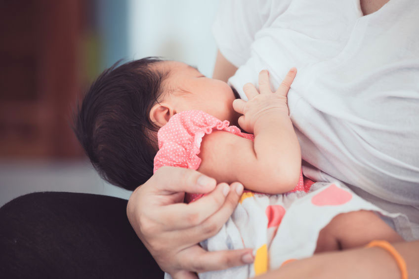 Baby breastfeeding in cradle hold
