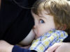Close up of pre-schooler breastfeeding