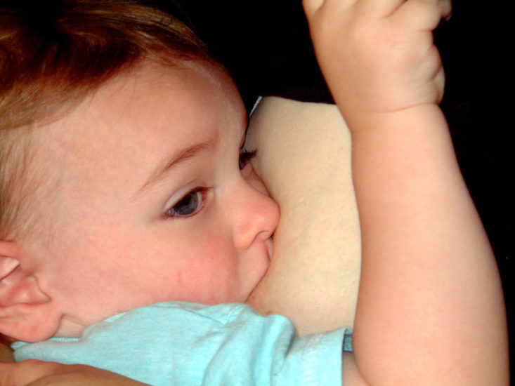 close up of toddler breastfeeding
