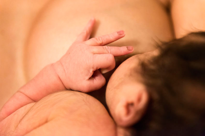 close up of baby breastfeeding