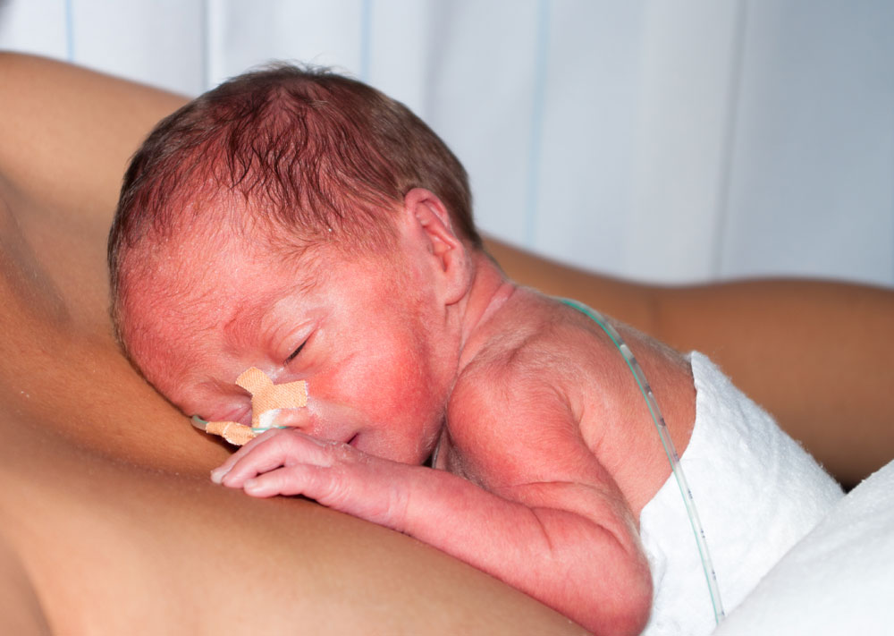 premature baby on mother's chest