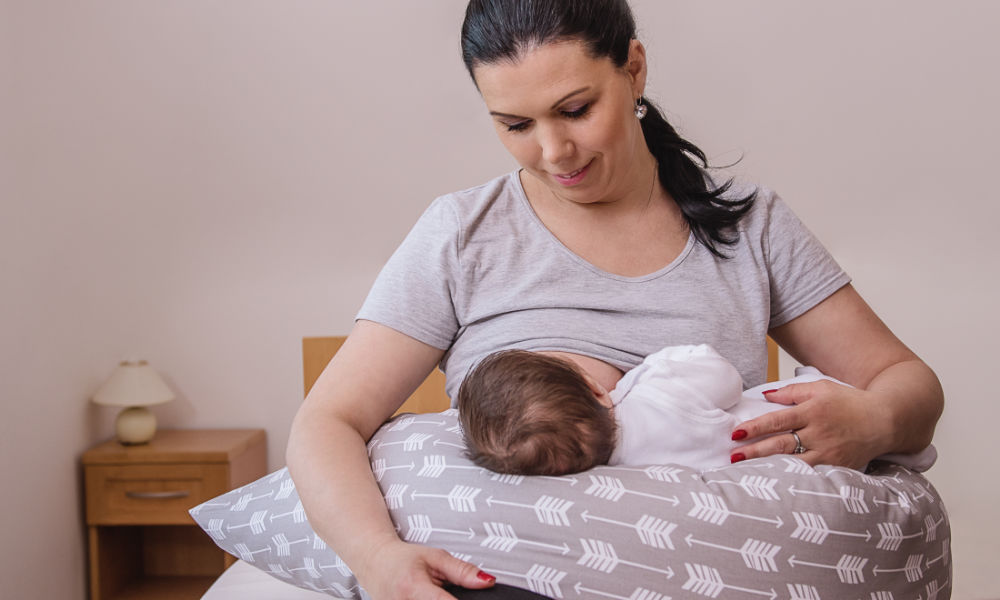 How to Breastfeed with large breasts: Breastfeeding Football Hold