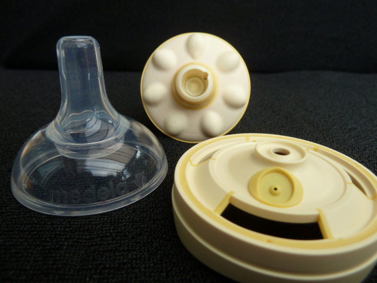 A medela calma teat with inside pieces displayed