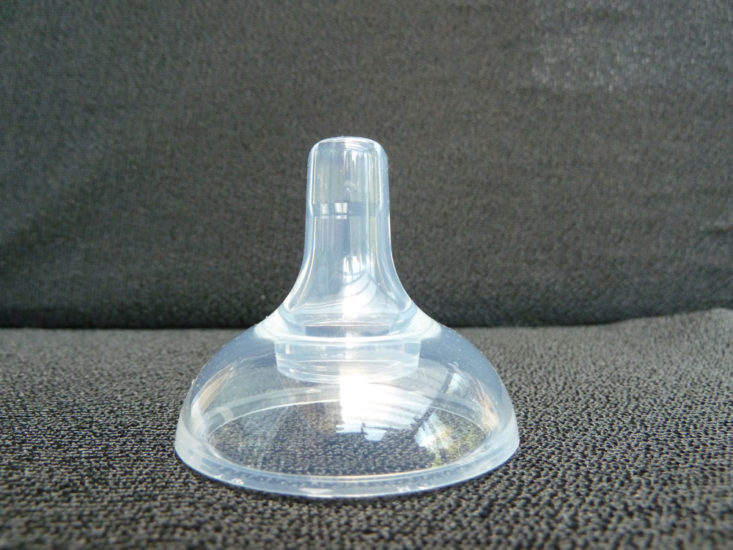 A tall narrow nipple teat on a wide base