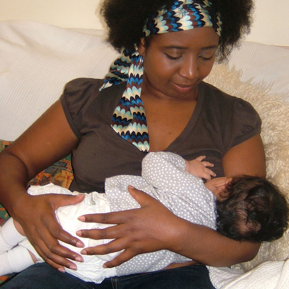 Mother breastfeeding in cradle hold